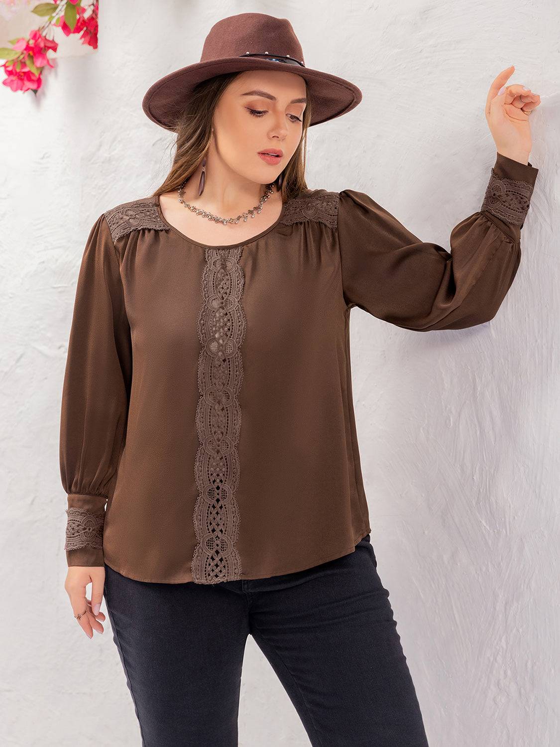 Plus size lace detail blouse with round neck, side pose.