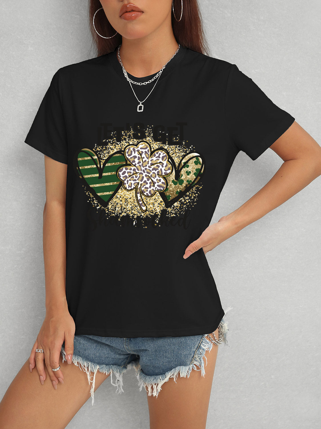 Black T-Shirt Featuring Shamrock Design and Denim