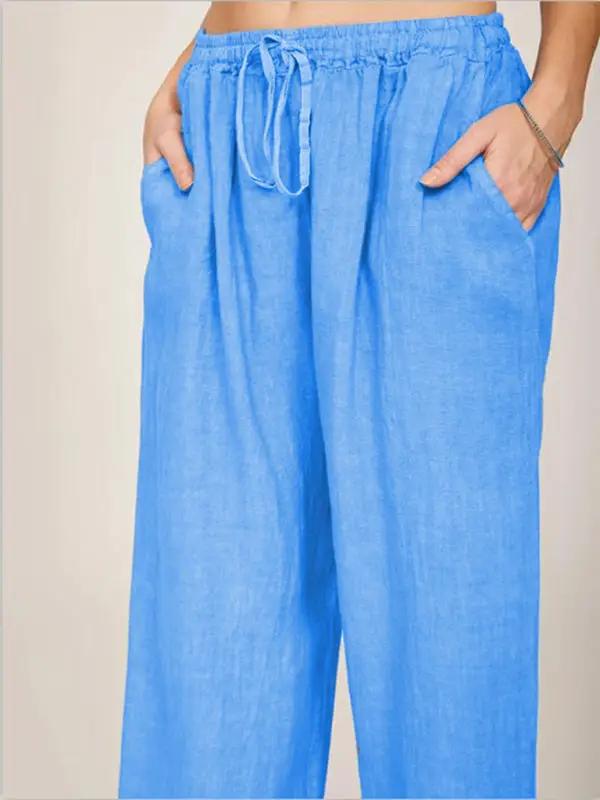 Close-up of blue cotton pajama pants with drawstring and pockets