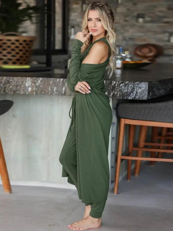 Side view of woman in green knitted loungewear set