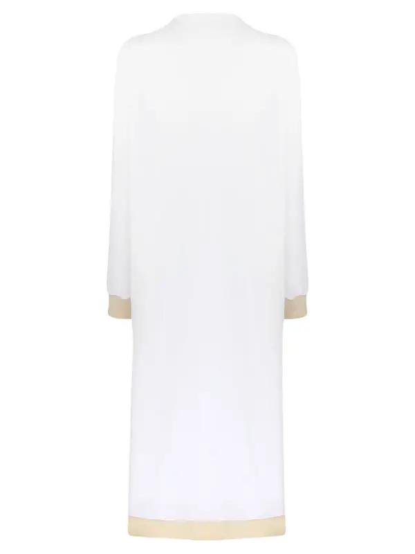 Back view of white cardigan jacket with beige trim