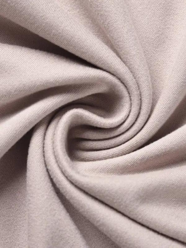 Close-up of beige fabric texture for two-piece set