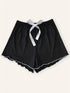 Black knitted pajama shorts with white ribbon detail