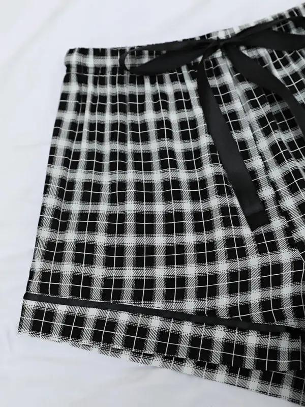 Detail of plaid pattern on pajama shorts