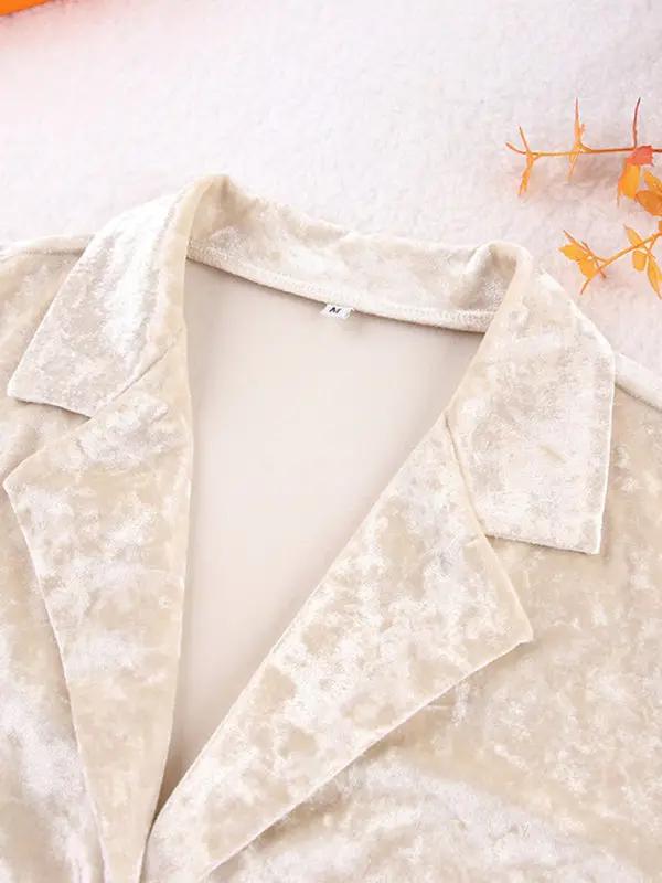 Collar detail of beige velvet pajama top
