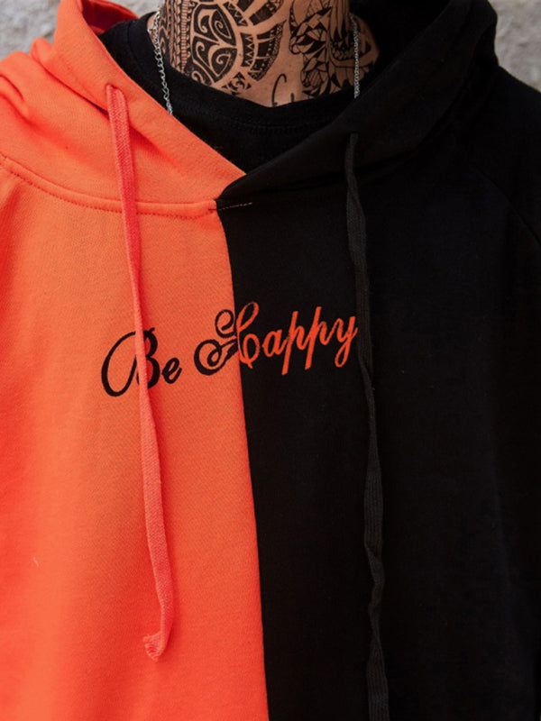 Close-up of orange and black smiley sweatshirt design