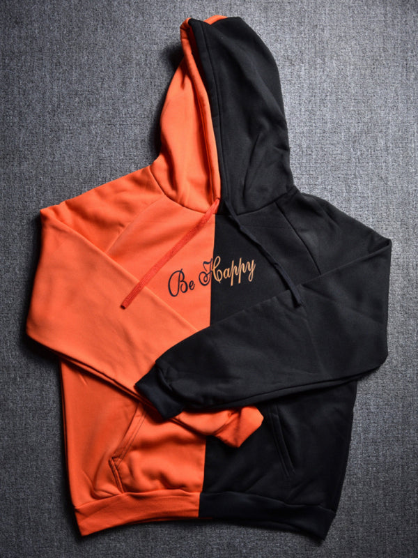 Orange and black color block smiley sweatshirt, flat lay