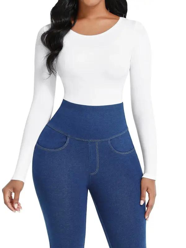 White long-sleeved jumpsuit paired with blue high-waist pants