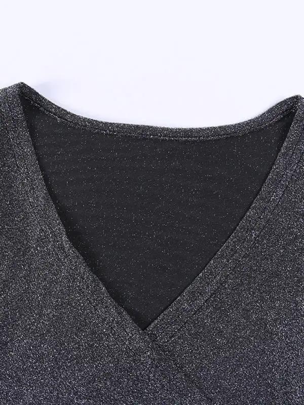 V-neck detail on black silk bodysuit