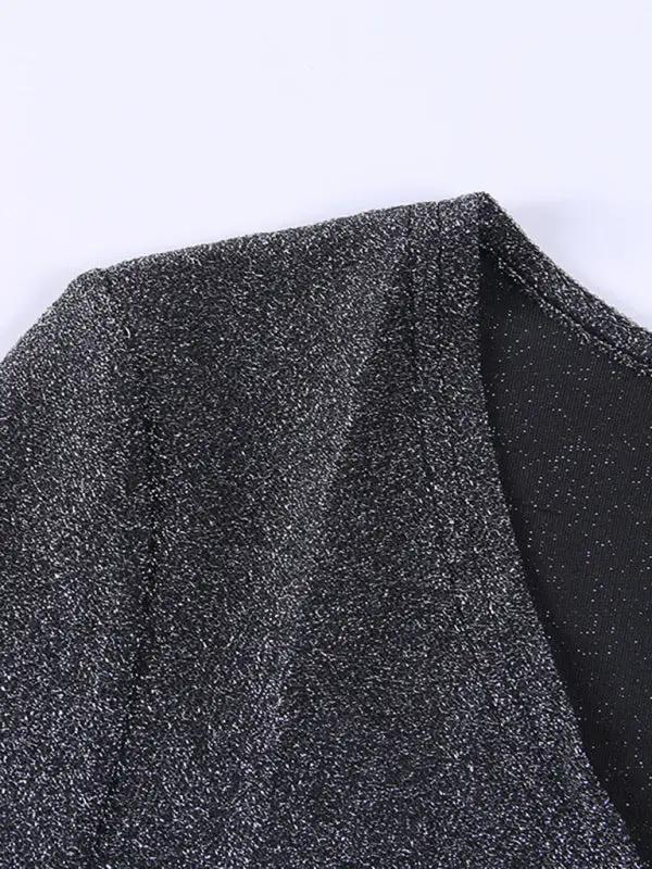Close-up of black silk bodysuit fabric