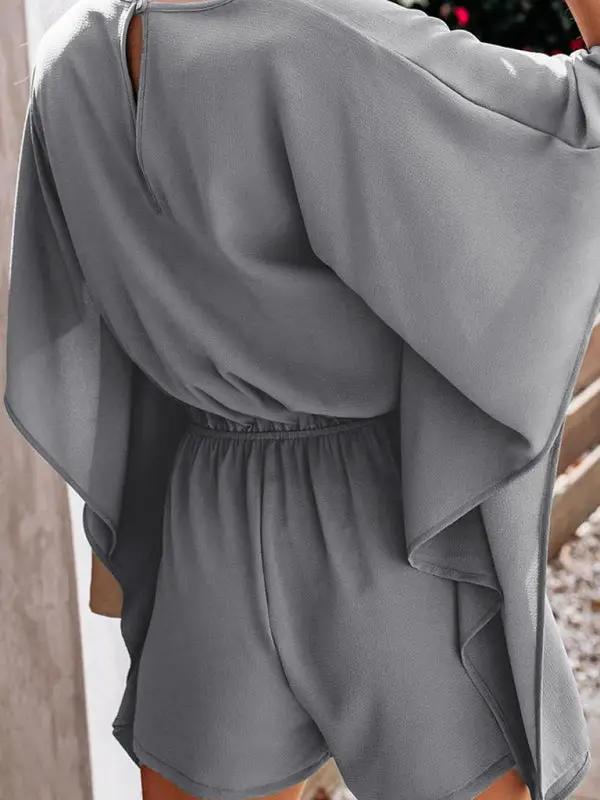 Close-up of gray V-neck high waist jumpsuit
