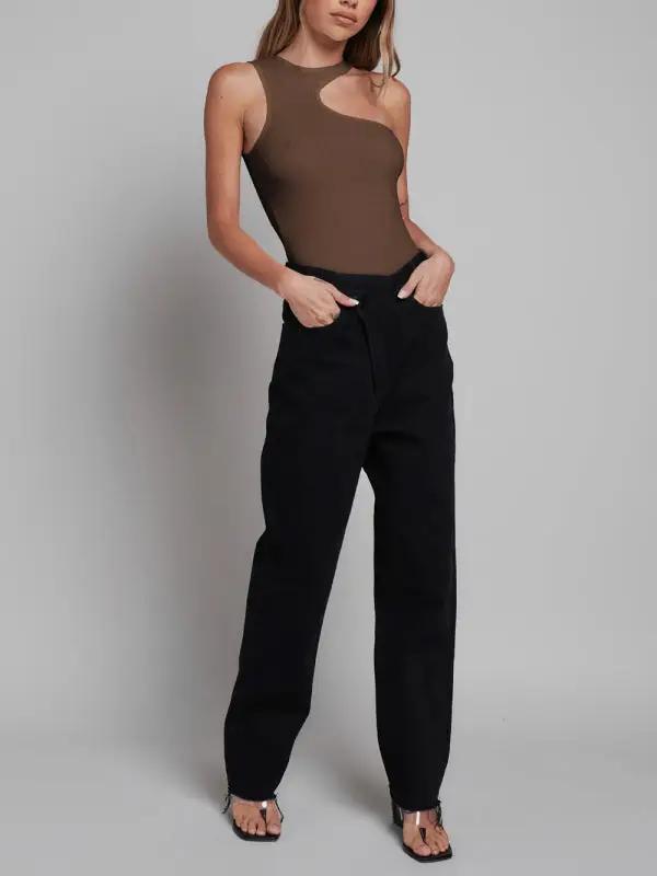 Brown sleeveless jumpsuit paired with black pants