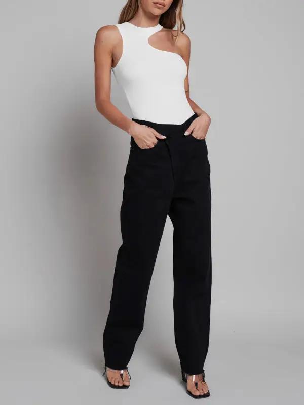White sleeveless jumpsuit paired with black pants