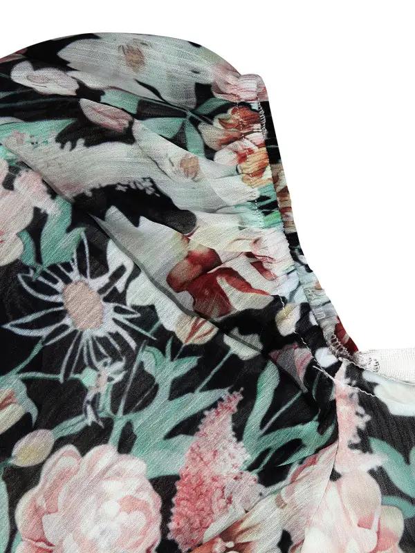 Close-up of black floral fabric detail on jumpsuit