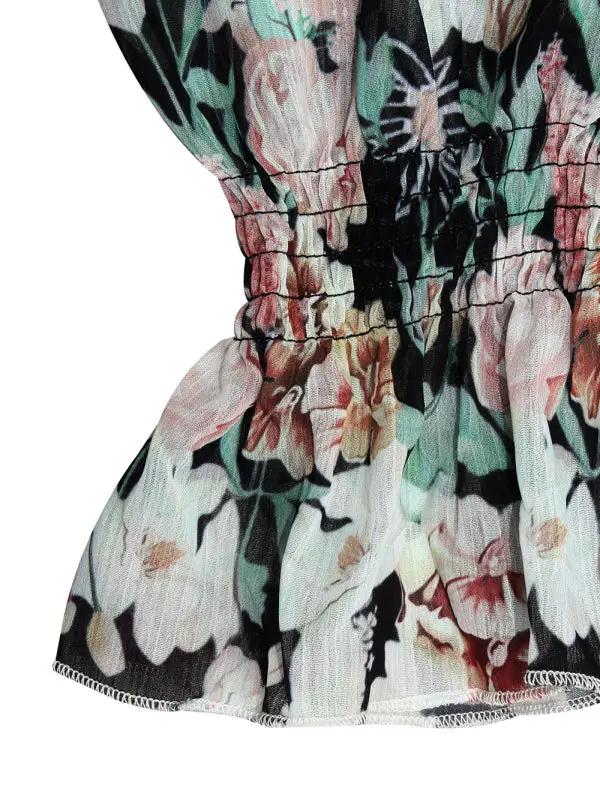 Close-up of floral fabric detail on jumpsuit