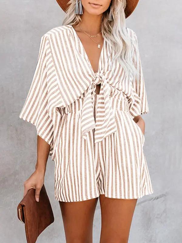 Brown striped jumpsuit with deep V and trumpet sleeves
