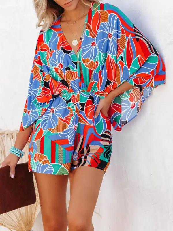 Vibrant floral design short sleeve jumpsuit with waist detail