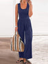 Blue sleeveless loose jumpsuit with a woven bag