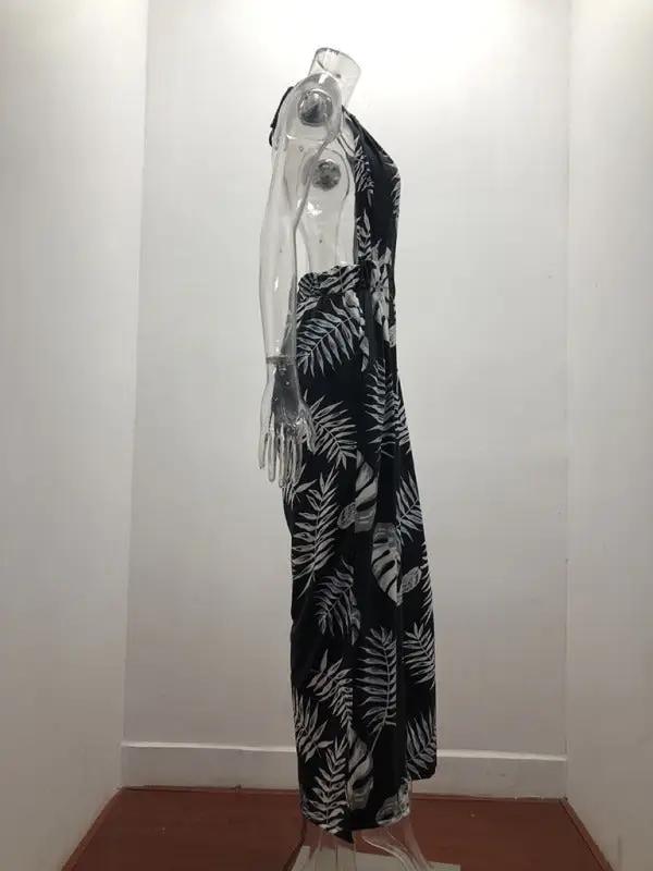 Side view of black and white printed halter neck jumpsuit