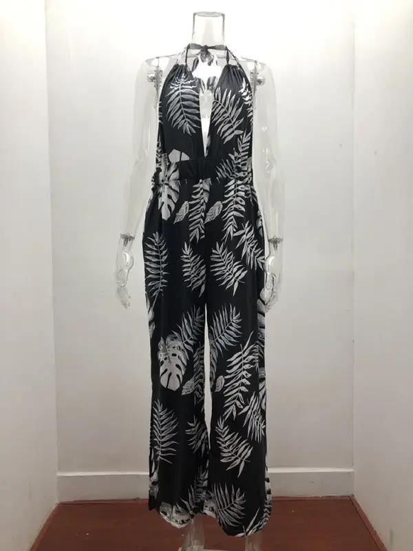 Front view of black and white printed halter neck jumpsuit