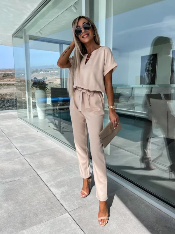 Model in beige short-sleeved V-neck cropped jumpsuit