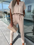 Beige V-neck tie-up cropped jumpsuit with slip pockets