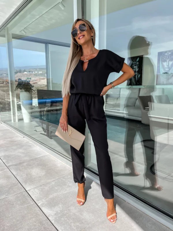 Back view of black elastic waist cropped jumpsuit