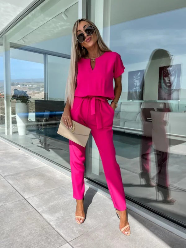 Black V-neck tie-up cropped jumpsuit with slip pockets