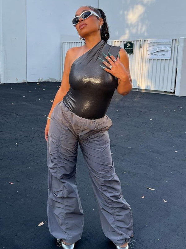 Black one-shoulder sleeveless jumpsuit with gray pants