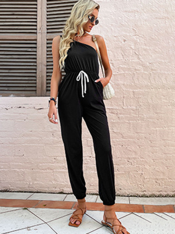 Model wearing black one-shoulder jumpsuit