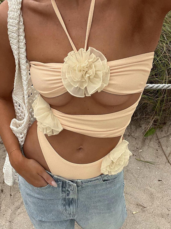 Halter neck jumpsuit with floral design and jeans