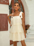 Elegant cream strappy mesh tiered dress with bow details