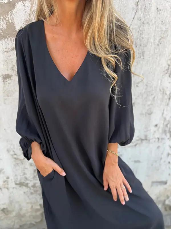 Black V-neck lantern sleeve dress, close-up