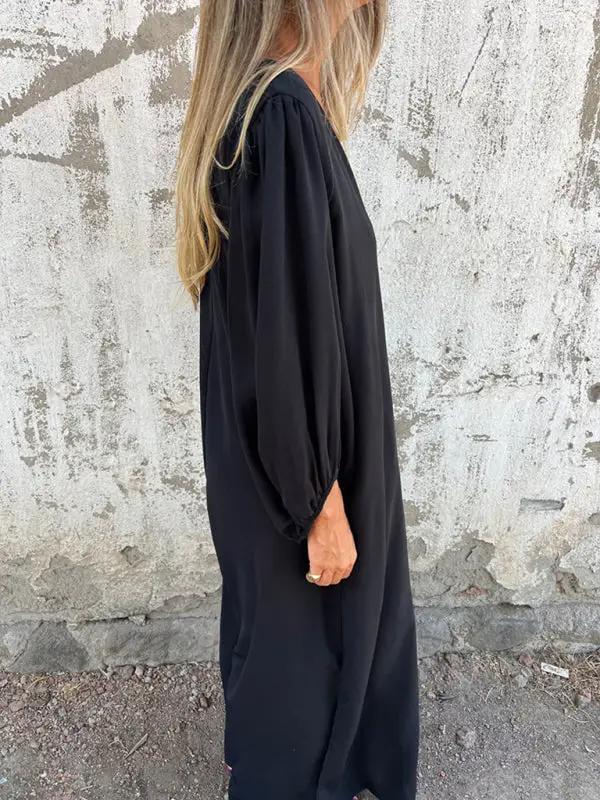 Black V-neck lantern sleeve dress, side view