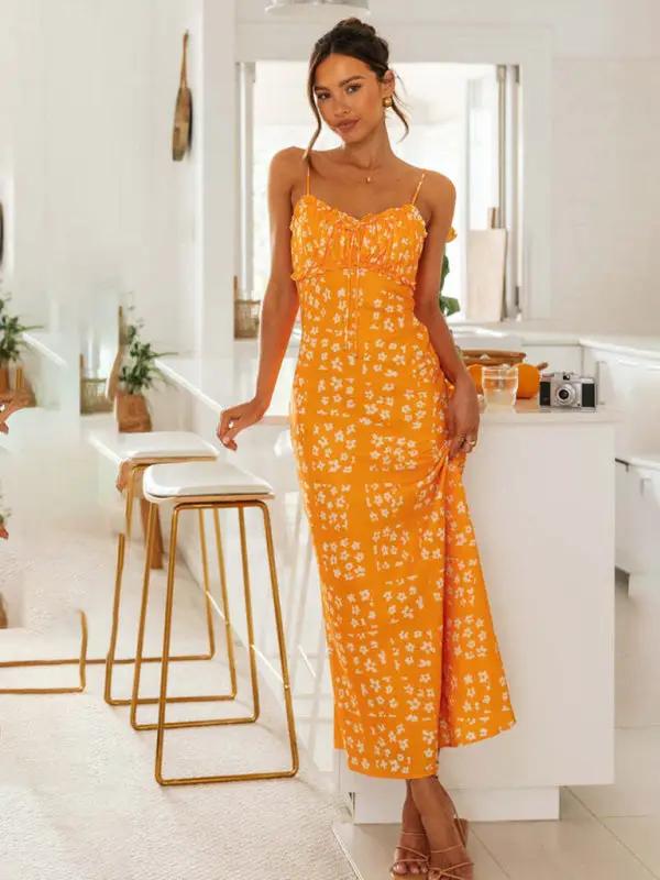 Woman in orange floral V-neck backless dress
