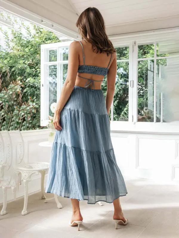 Blue sleeveless long dress with cutout details, back view