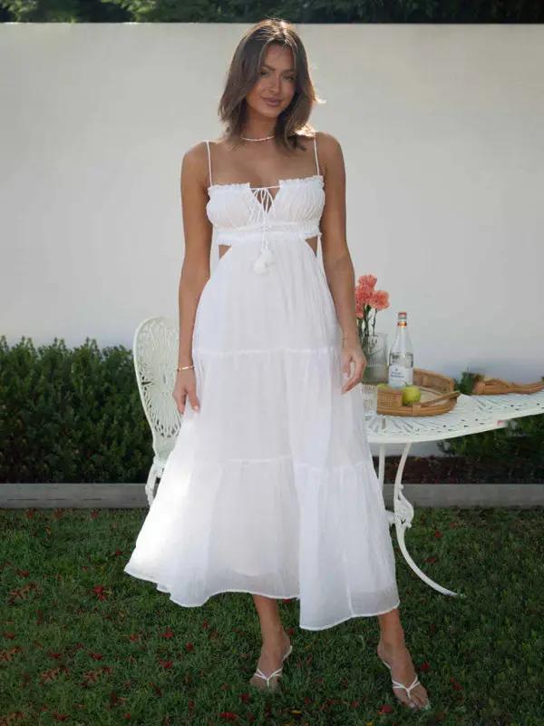 White sleeveless long dress with cutout details, front view