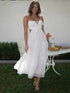 White sleeveless long dress with cutout details, front view