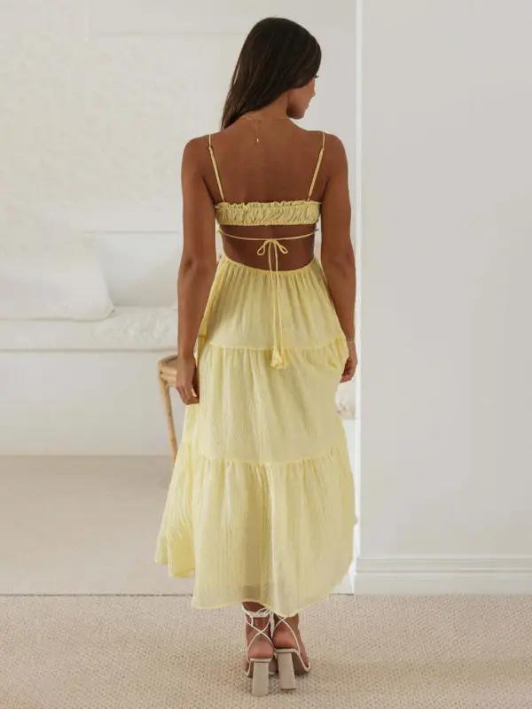 Yellow sleeveless long dress with cutout details, back view