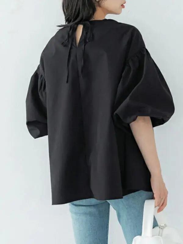 Back view of black lantern sleeve shirt