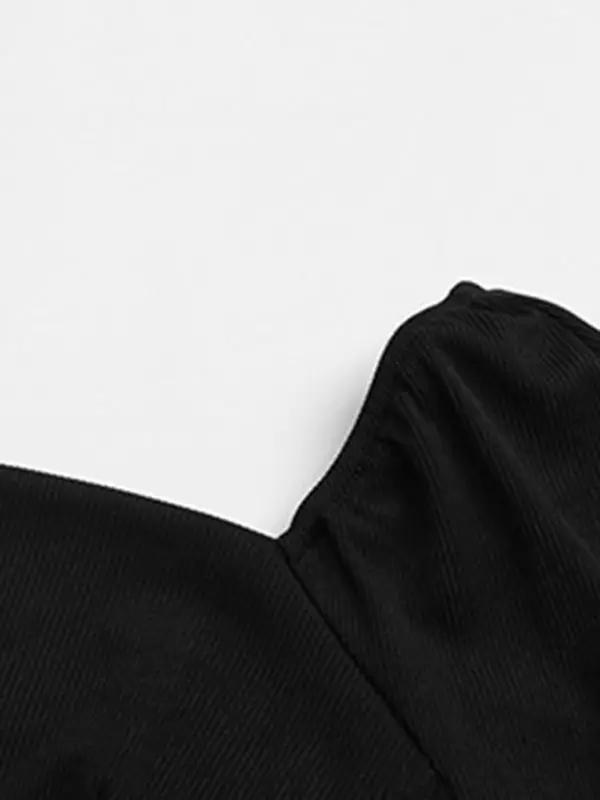 Detail of black ribbed knitted fabric