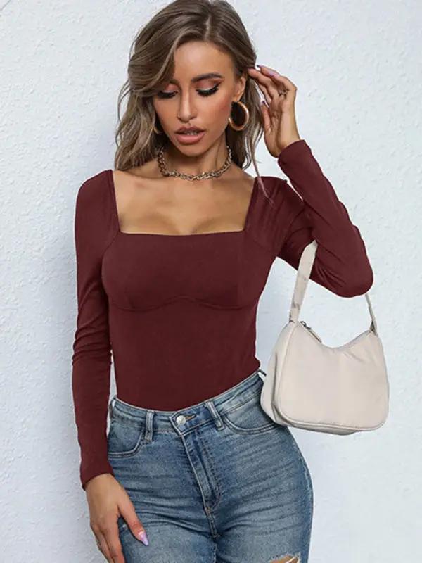 Brown ribbed jumpsuit styled with a white bag