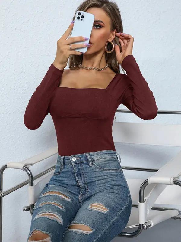 Woman in brown jumpsuit taking a selfie