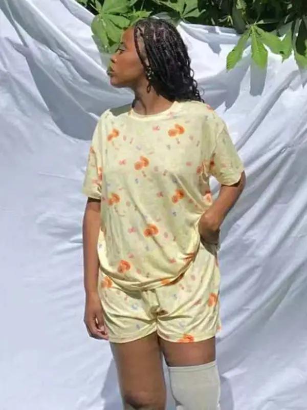 Woman posing in yellow printed pajamas
