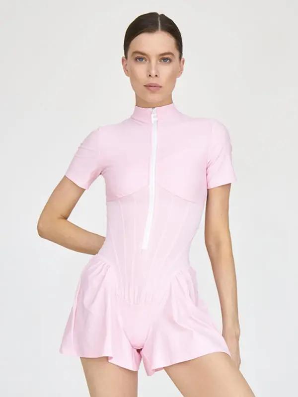 Model in pink short sleeve zipper jumpsuit