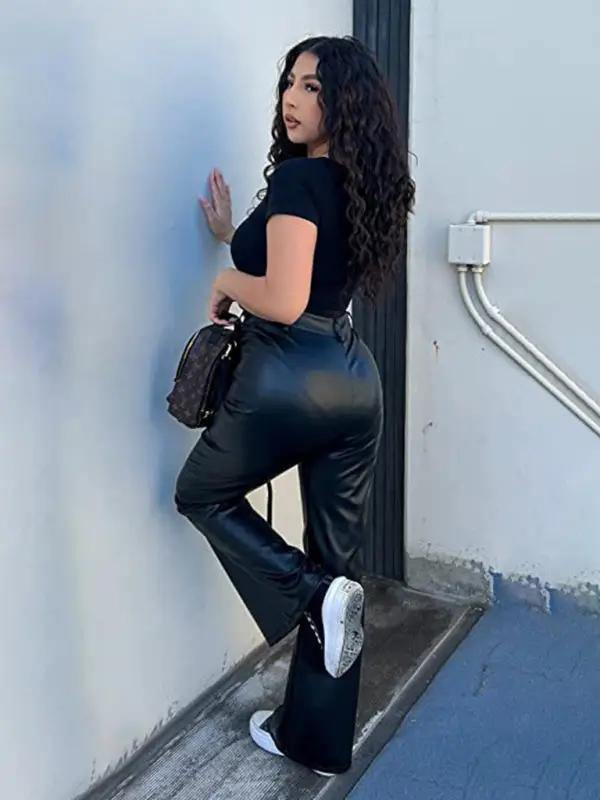 Model in black bodysuit with leather pants
