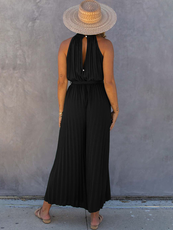 Back view of black pleated halter neck jumpsuit