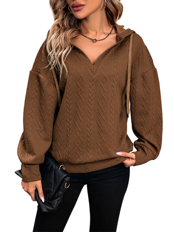 Model wearing brown knitted hooded sweatshirt
