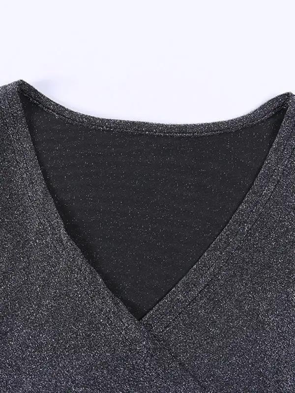 Close-up of black v-neck bright silk fabric
