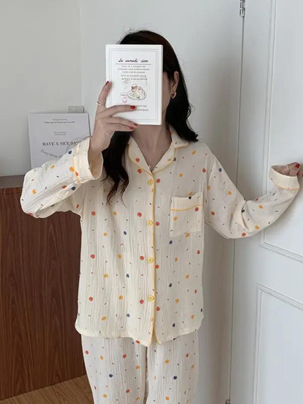 Woman holding book in dot print cotton pajamas